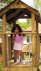 Child in a playhouse.