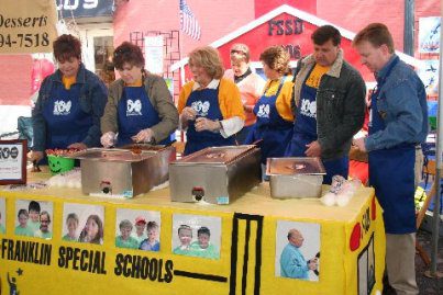 FSSD employees man the booth at the 2006 Franklin Tomorrow Chili Cookoff during PumpkinFest. Employees (l-r) Sharon Ladner, Joy Crunk, Charlotte Stinson, Sharon Cooksey, David Snowden and John McAdams wait for the lunch crowd to arrive.