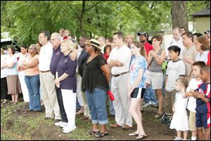 onlookers watch groundbreaking