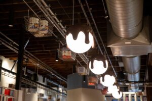 Faux chocolate covered lights at Goo Goo Chocolate Co in downtown Nashville, TN, the location offers Design Your Own Confection Stations, a new Chocolate Bar menu including boozy milkshakes, interactive classes, and more!