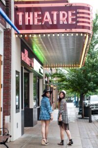 Women standing at The Franklin Theatre in Downtown Franklin, Tennessee.