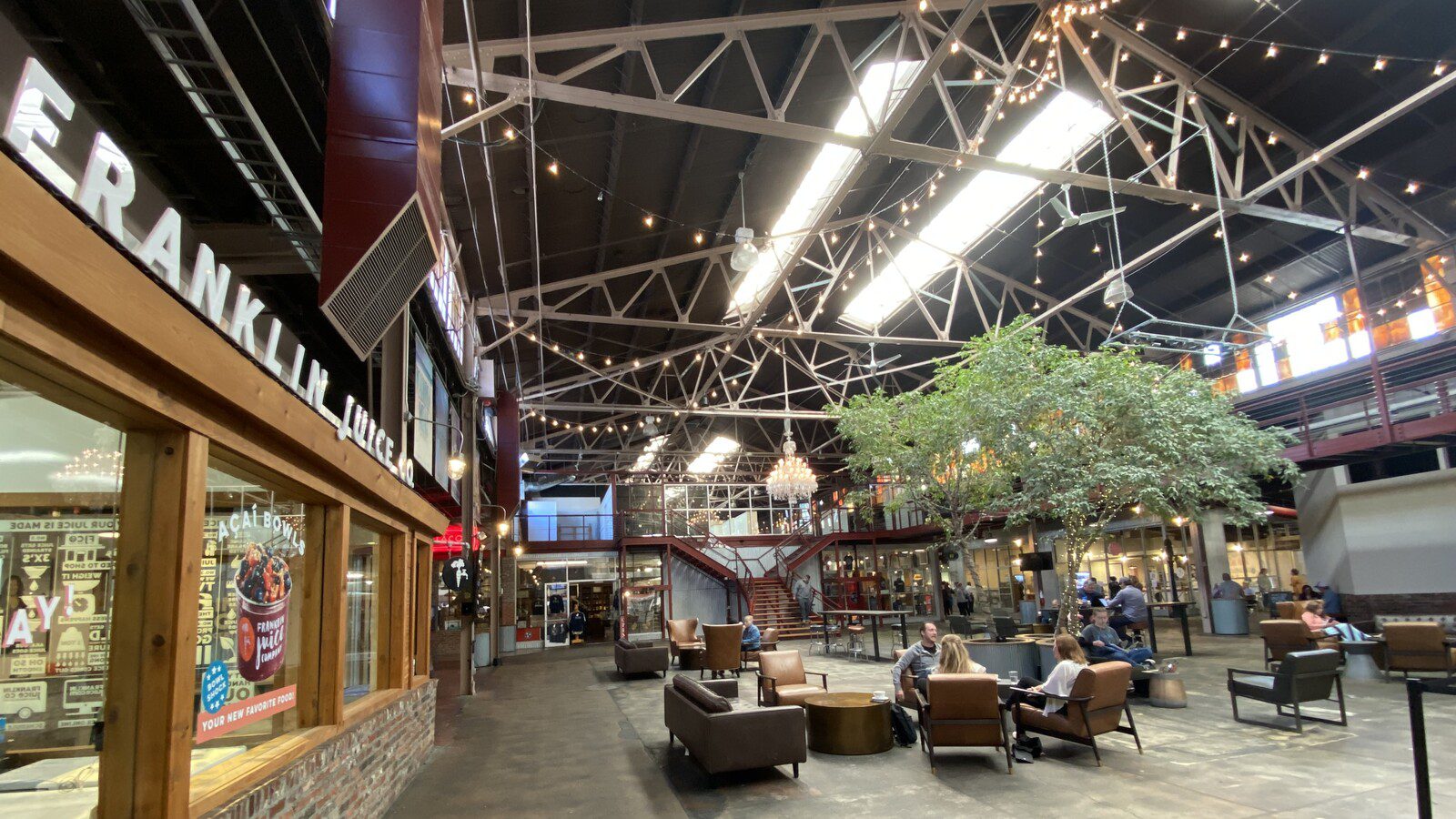 Interior gathering area, Factory at Franklin is a historic property and a top destination for shopping artisan goods, trying culinary delights, and watching great live entertainment.