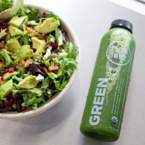 Salad and a juice, Clean Juice in Brentwood, TN offers fresh juices, juice cleanses, sandwiches, protein smoothies, acai bowls, wraps, greenoa bowls, snacks, avocado toast, wraps and cold press juices.