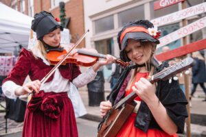 Dickens of a Christmas Downtown Franklin, Tennessee - Violin Players Entertaining the Festival Streets.