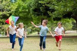 Kids playing with a kite in the park in Franklin, Tennessee.