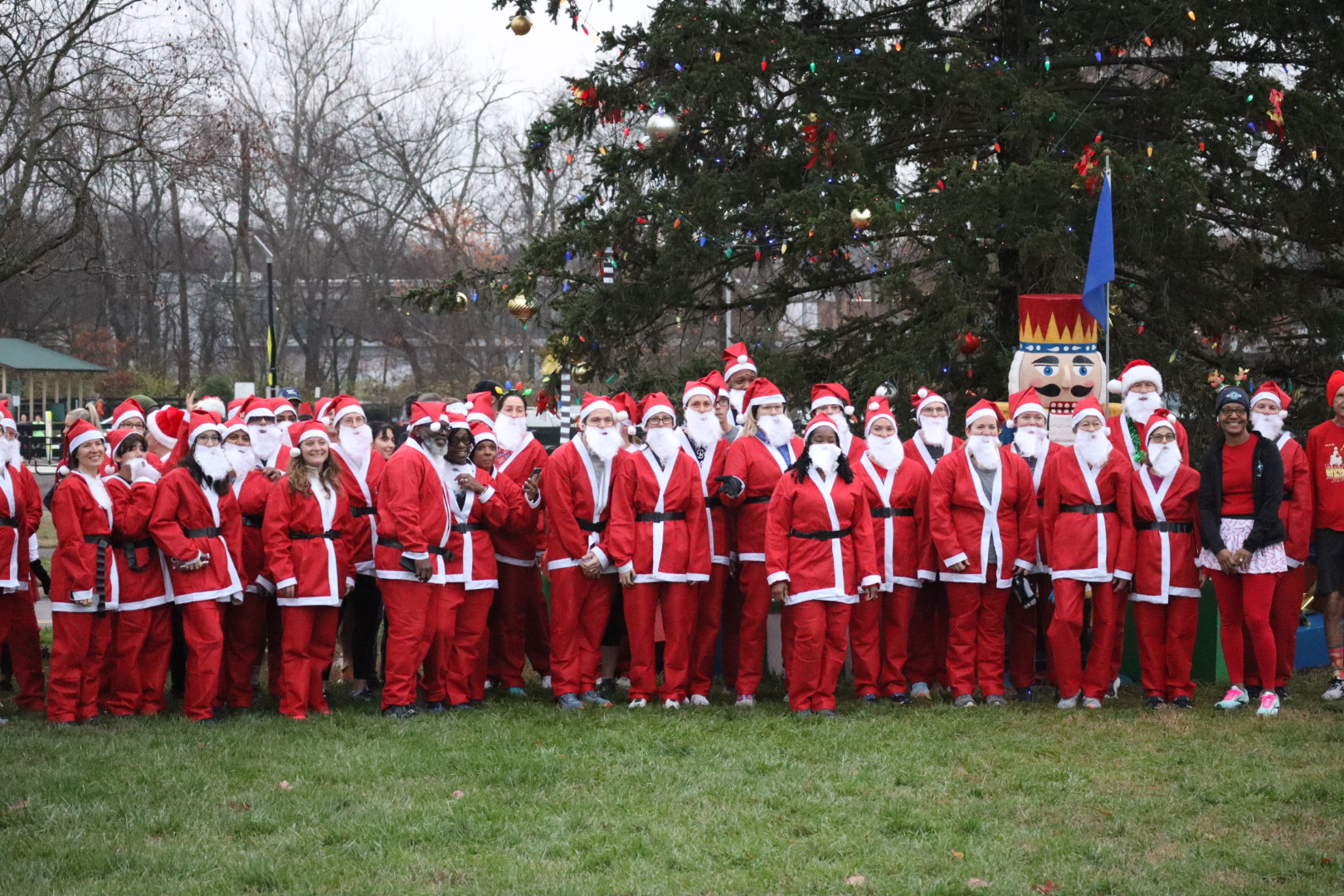 Festive 5K Fun Run & Walk in Brentwood, TN, Participants wearing Santa outfits.