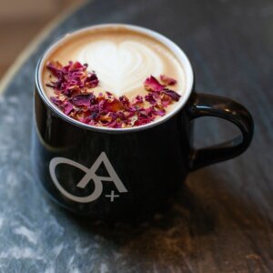Onyx and Alabaster Coffee Lounge in downtown Franklin, TN, a coffee drink in a decorated coffee cup.