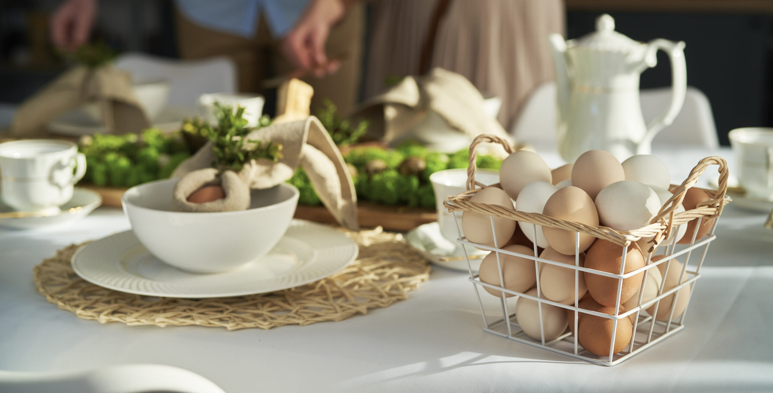 Rustic Easter table with basket of eggs for Easter dining in Brentwood, Tennessee.