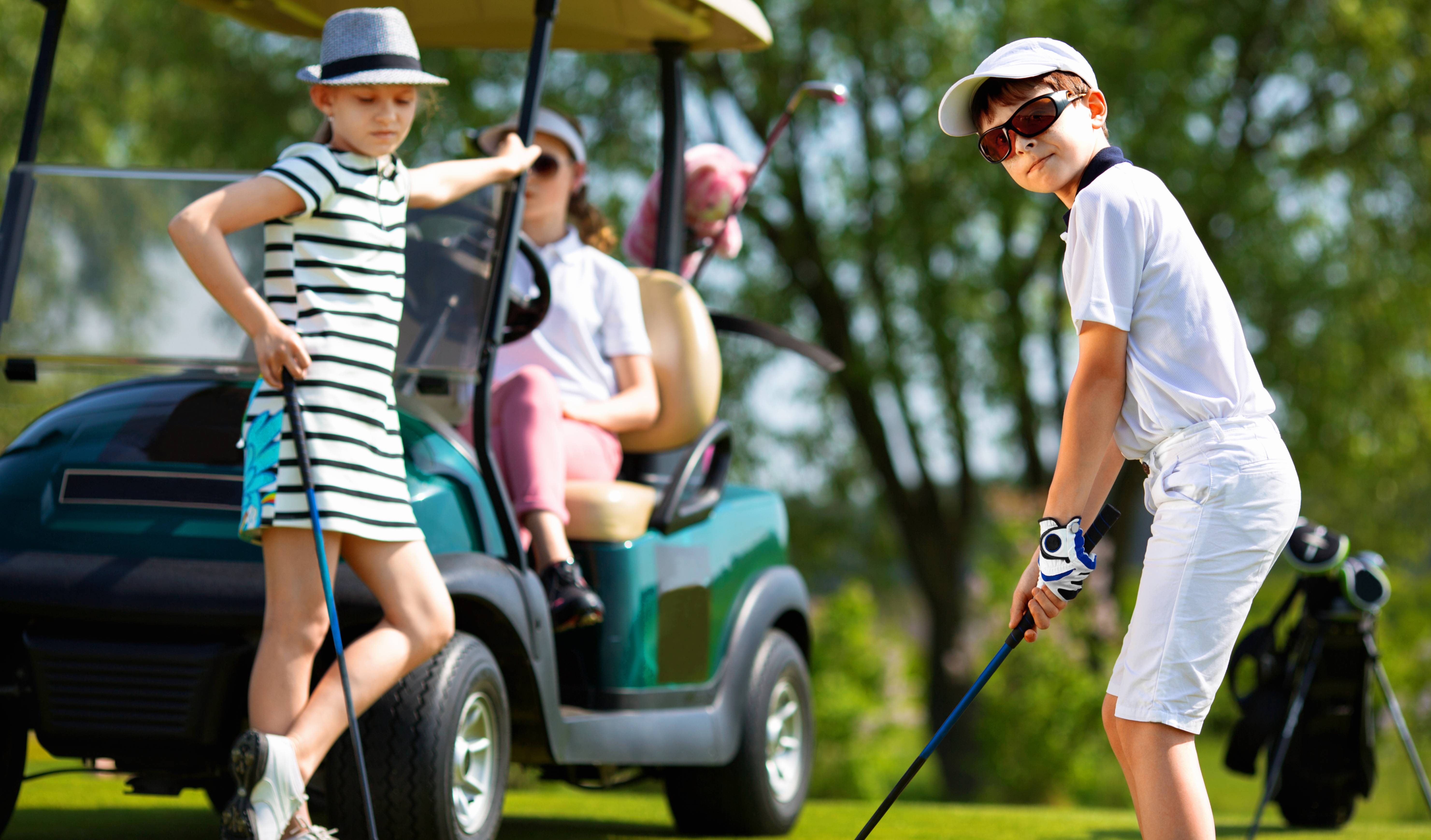 Kids playing golf with cart