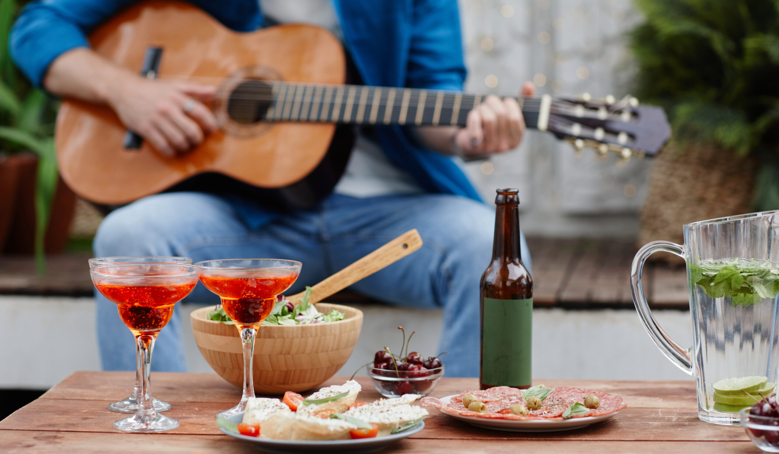 Musician playing guitar with food