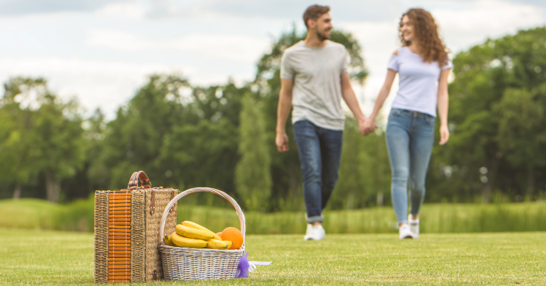 Day date picnic in Franklin, a couple walking the park to a picnic basket.