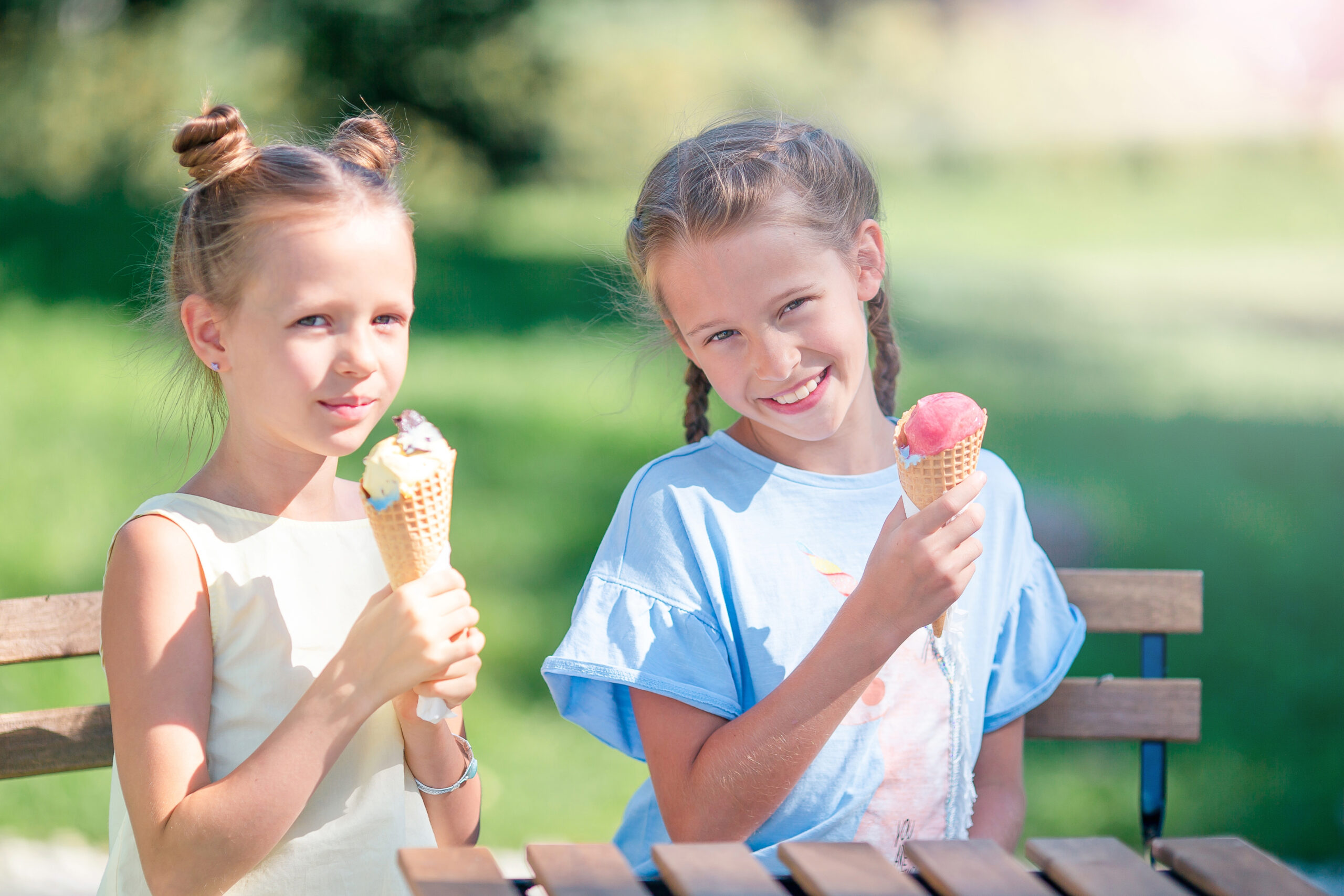 Children eating ice cream cones at a Franklin, Tennessee ice cream shop on an outdoor patio.
