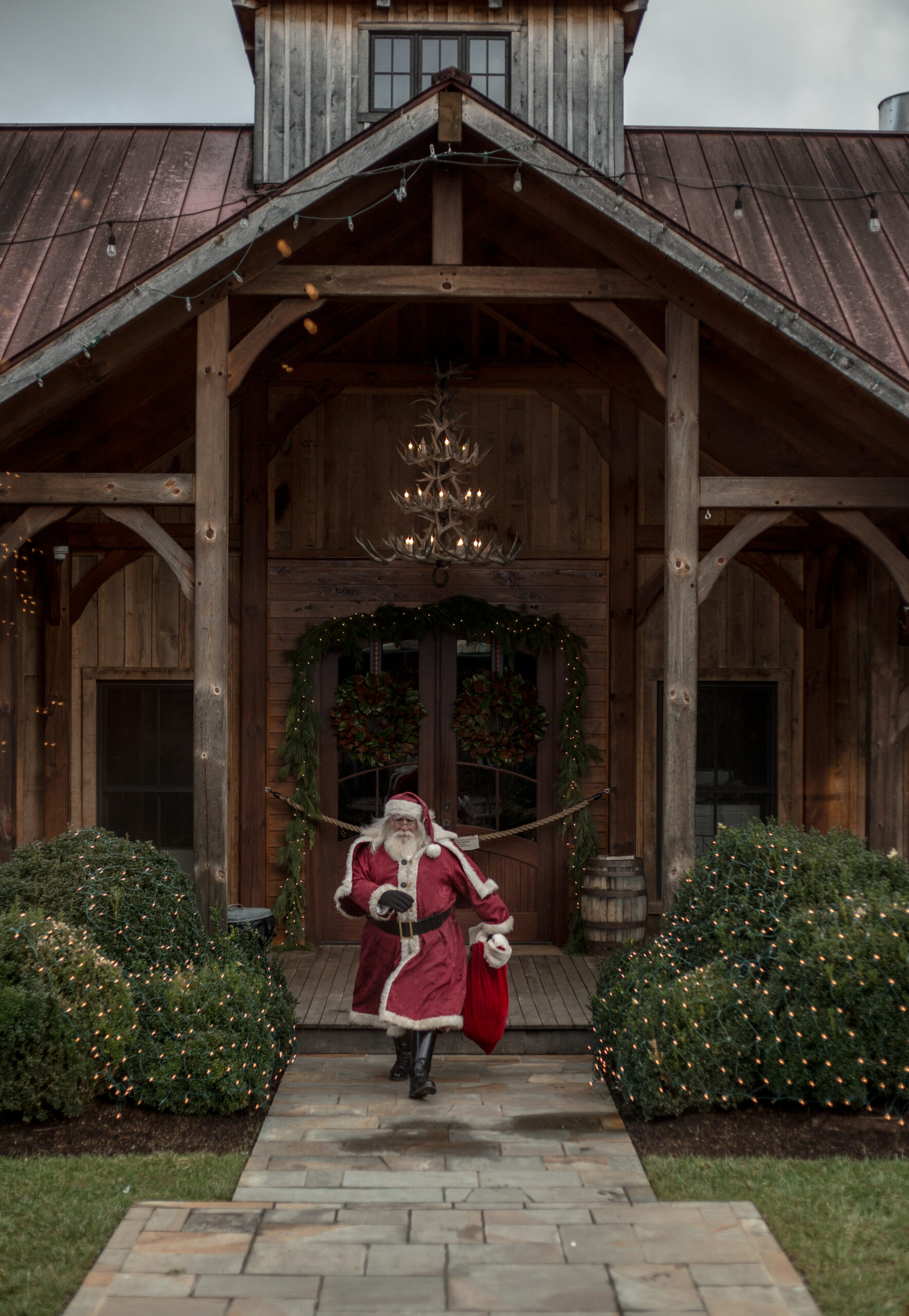 TN Whiskey Trail_Carols & Barrels_Santa outside Leipers Fork Distillery in Leiper’s Fork, Tennessee.