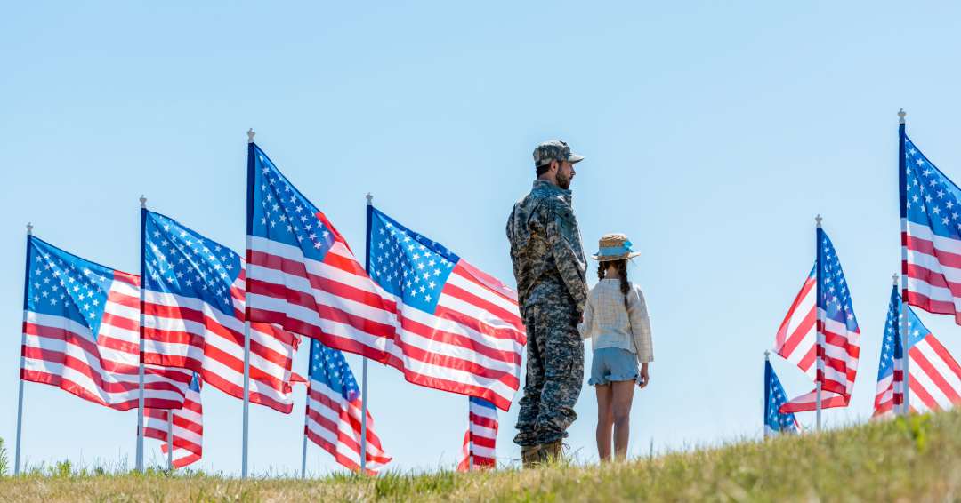 Veterans Day Franklin TN Soldier and girl with flag