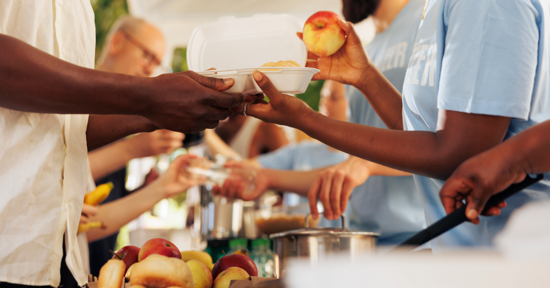 Volunteer opportunities in Franklin, Brentwood and Williamson County, TN, people lined up giving and receiving food.