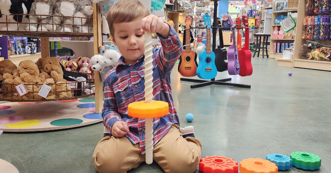 Learning Express boy playing with toys