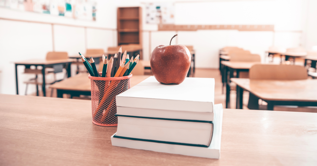 Williamson County Tennessee school classroom with books, pencils, and apple