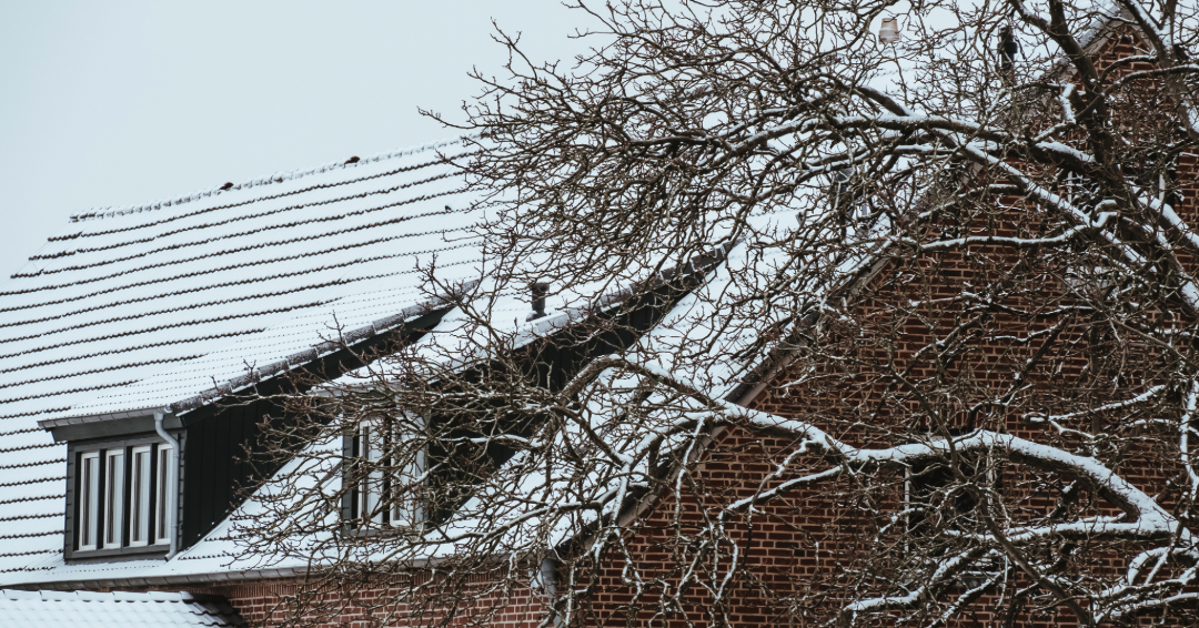 A roof covered in a dusting of snow, winter safety tips for Williamson County, TN. 