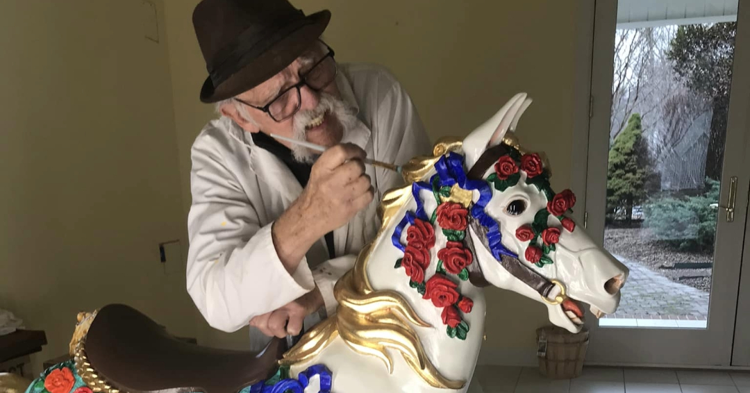 Ken Means painting the Carousel of Dreams