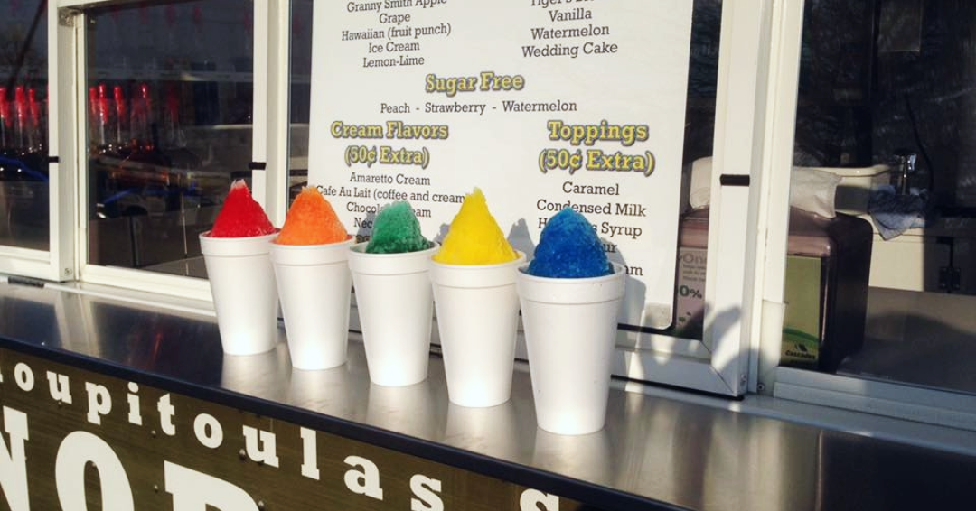 Colorful Snoball summer treats lined up on the counter of Tchoupitoulas Snoballs Stand in Franklin, TN.