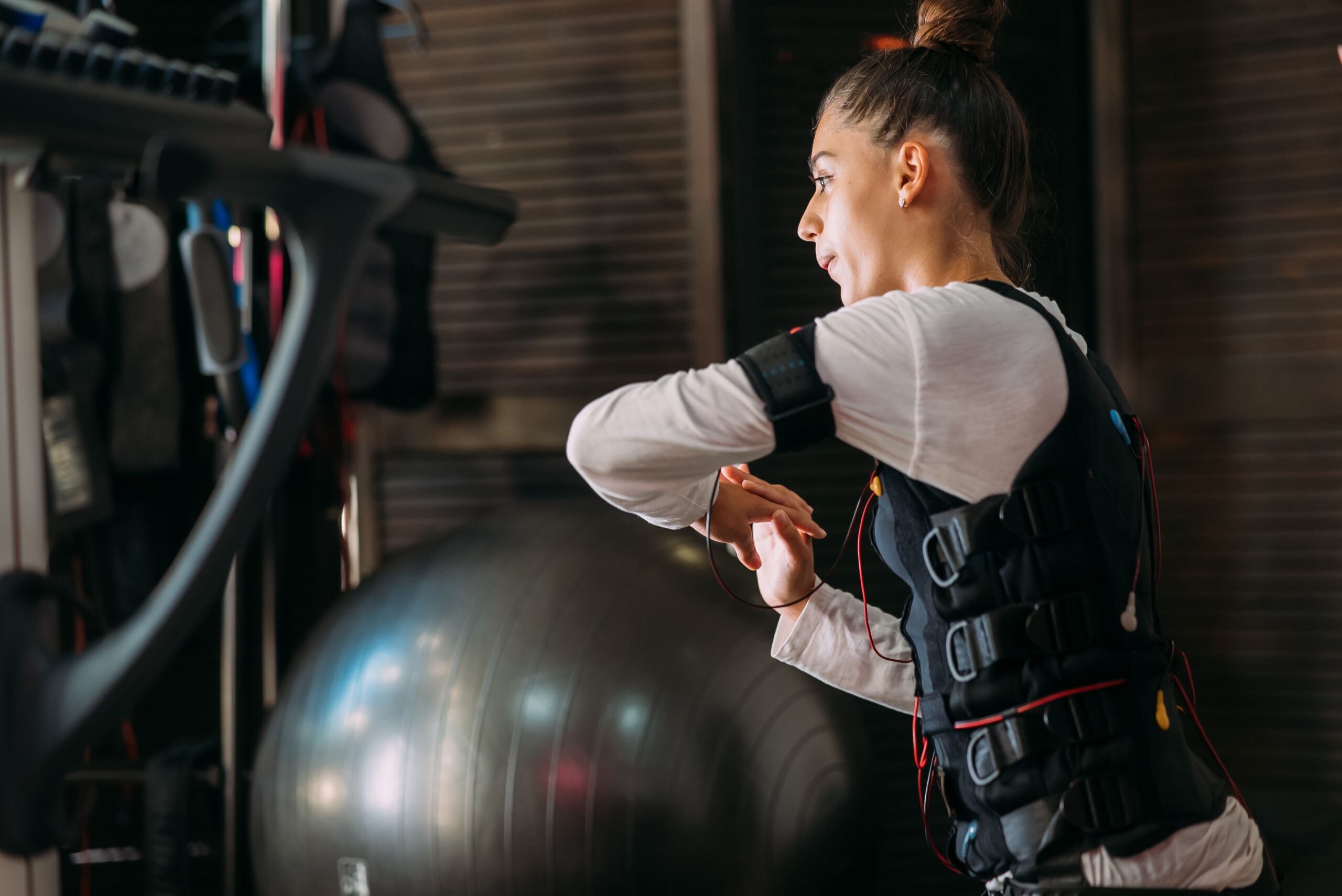 Woman Working out in an EMS suit.