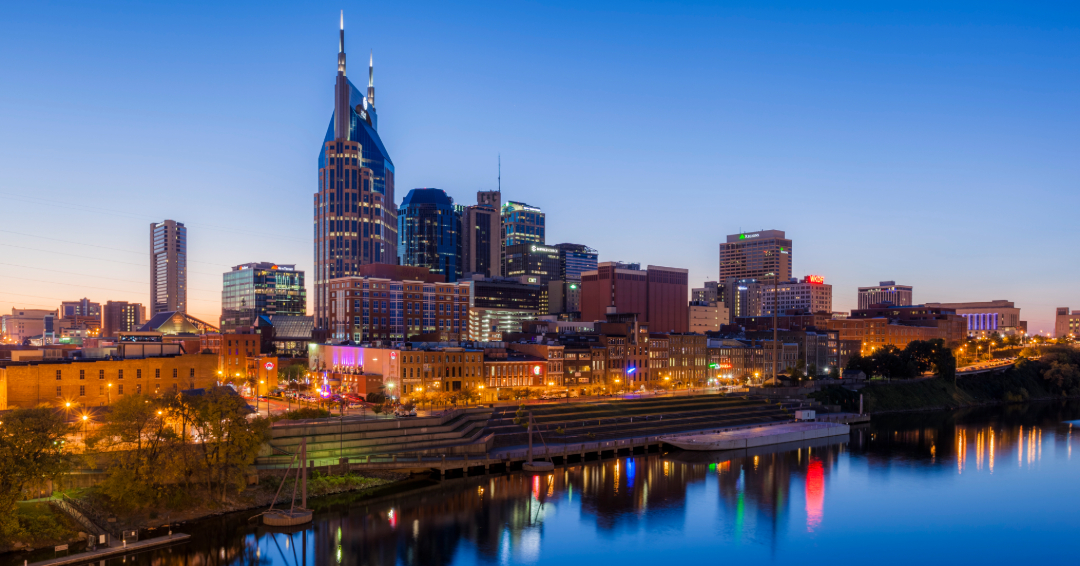 A view of downtown Nashville, TN during twilight, view over the Cumberland River.