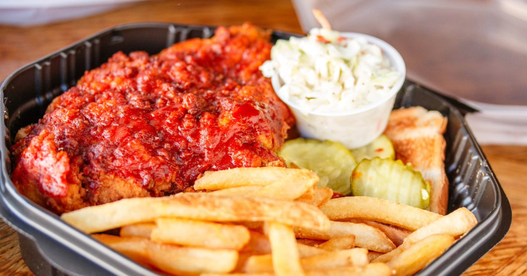 Puckett's Hot Chicken basket in Franklin, TN, with coleslaw, pickles, and fries.