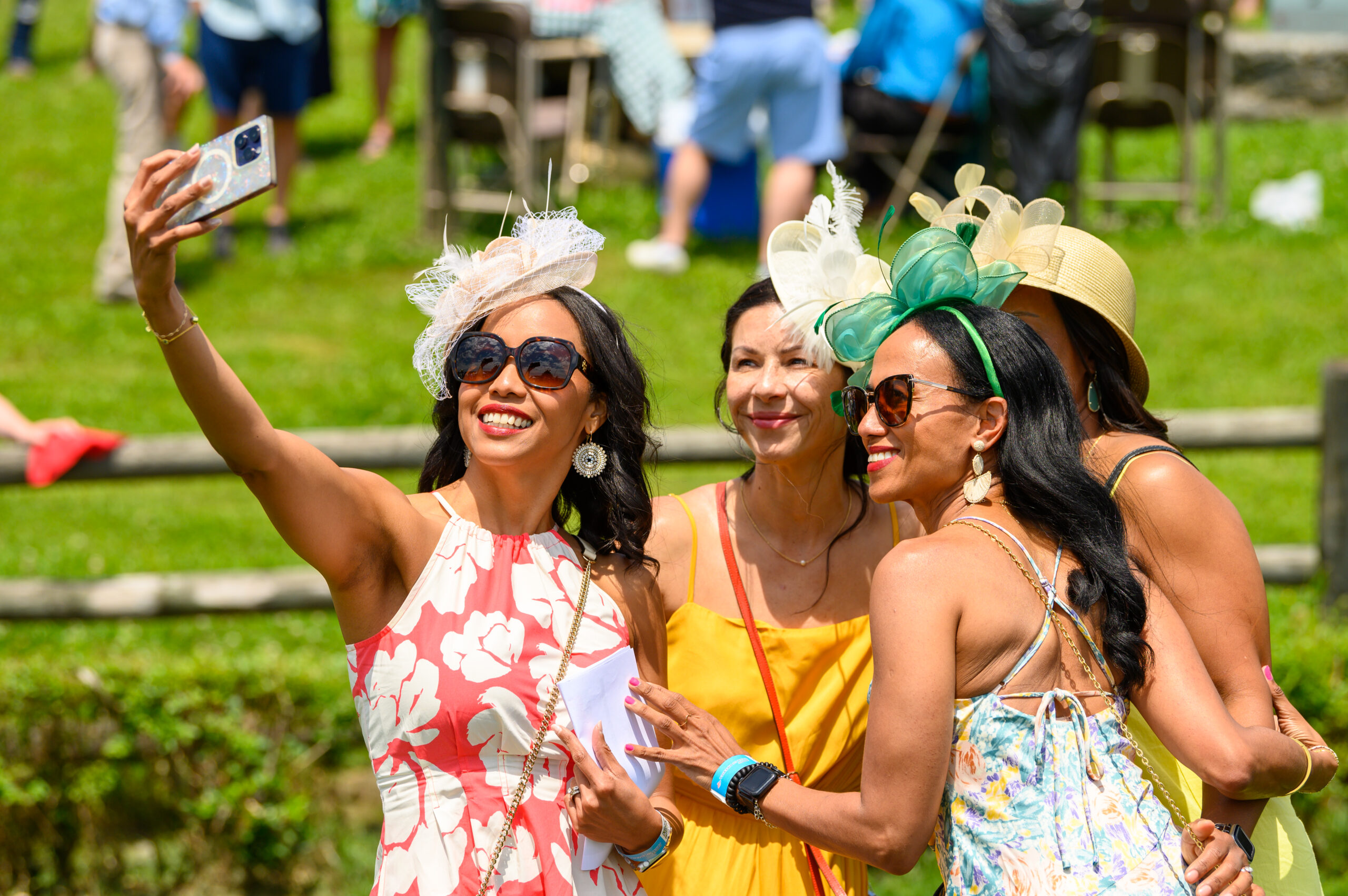 Iroquois Steeplechase Fashion Nashville, TN_Group of women in dresses, fascinator hats and hats.