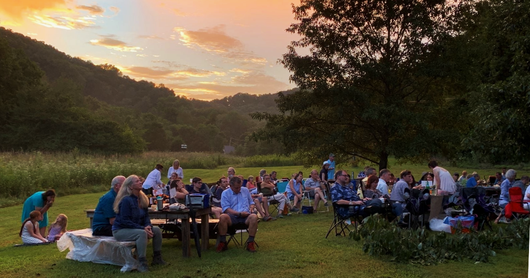 A group enjoys Music in the Meadow concert series at Owl's Hill Nature Sanctuary in Brentwood, TN.