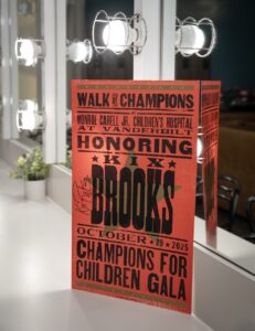102925 Champions for Children - A Hatch Show Print poster commemorating the event is photographed during the Champions for Children Gala on Wednesday, Oct. 29, 2025, at Ascend Amphitheater in Nashville, Tennessee.