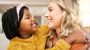 Foster care in Williamson County, TN, Woman smiling with adopted child