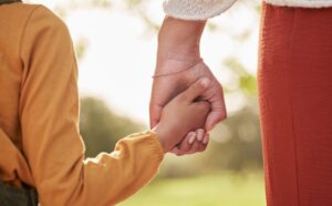Organizations that help children in Williamson County, TN, Mother and child holding hands
