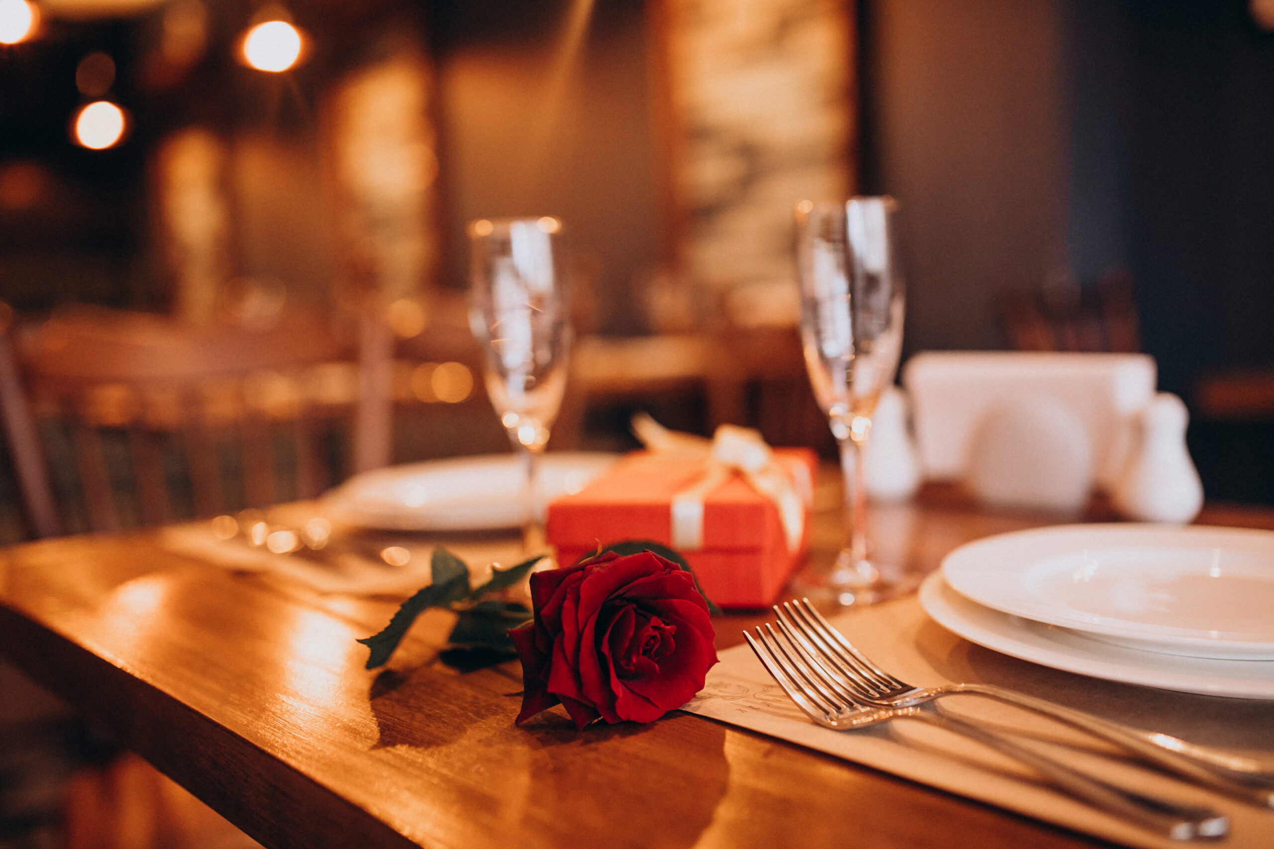 In Franklin, TN, a Valentine's Day is table is decorated at a restaurant with a rose.