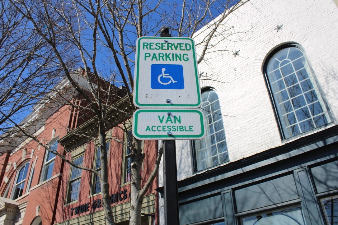 Parking in downtown Franklin, TN, showing a handicap reserve parking sign.