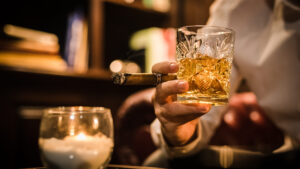 Cigar lounges, bars, and shops in Franklin, TN, cigar and whiskey in hand.
