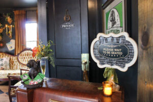 Black Dog Pub Music Lounge in Franklin, TN, waiting area and "Please Wait to Be Seated" sign 