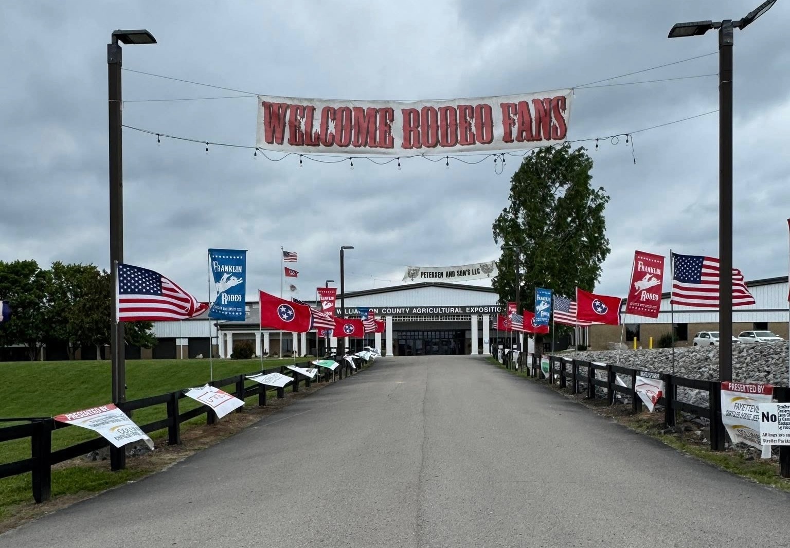 Franklin Rodeo entrance with welcome sign and flags at Williamson County Ag Expo Park in Franklin, Tennessee