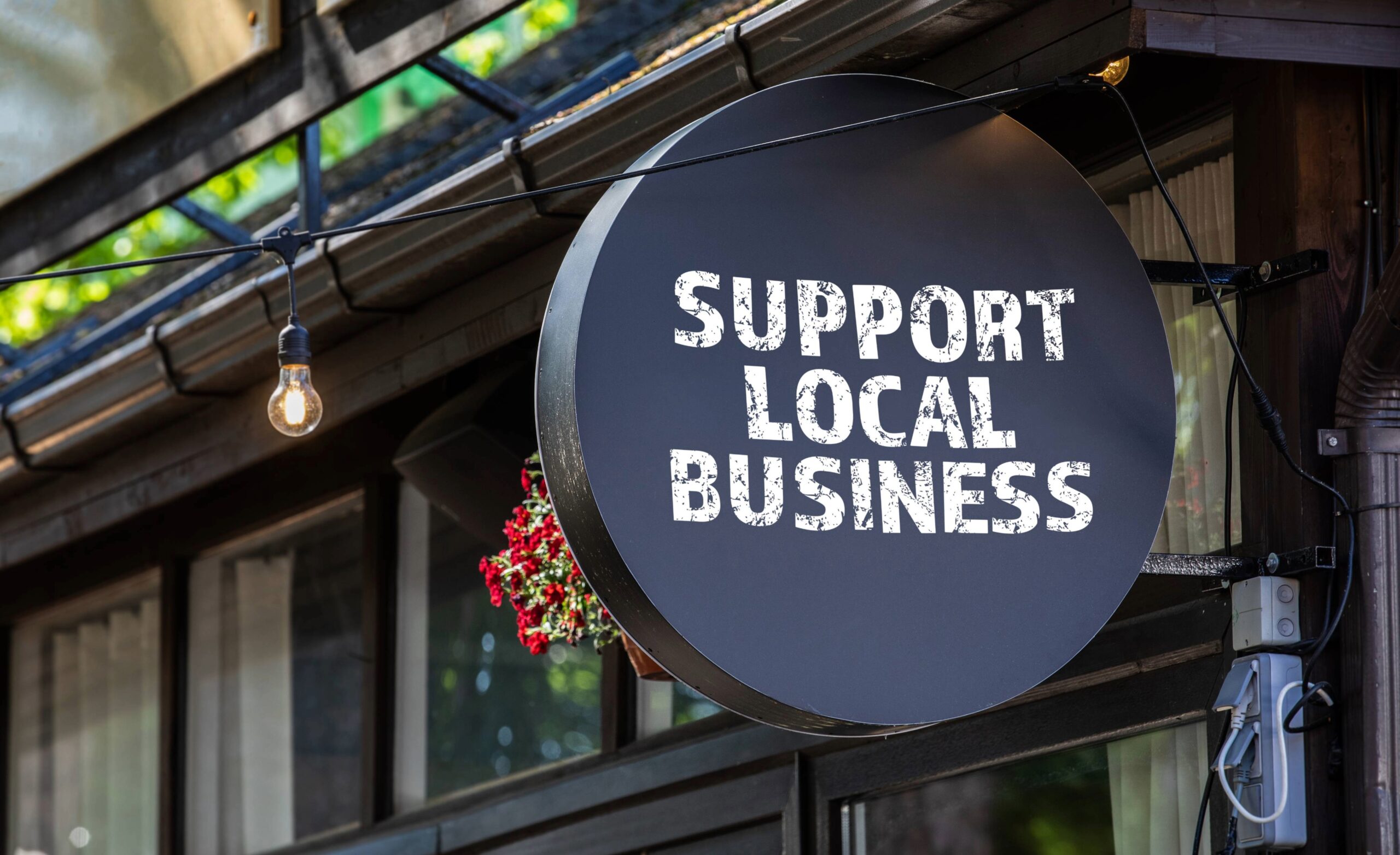 Support local business sign representing the Painted Tree vendor market at The Factory at Franklin