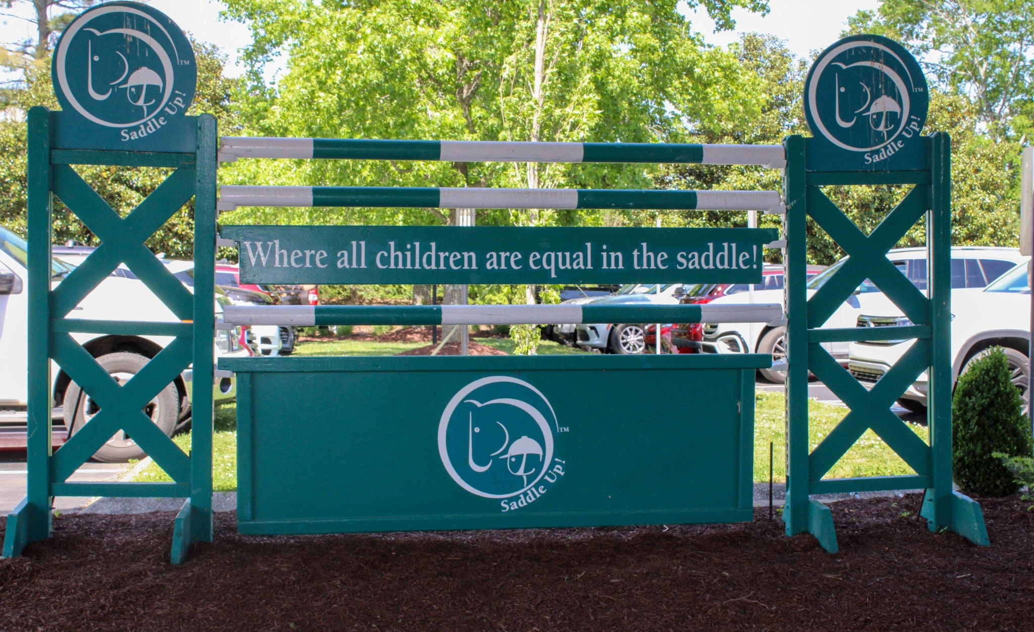 Saddle Up equestrian sign in Franklin TN reading where all children are equal in the saddle