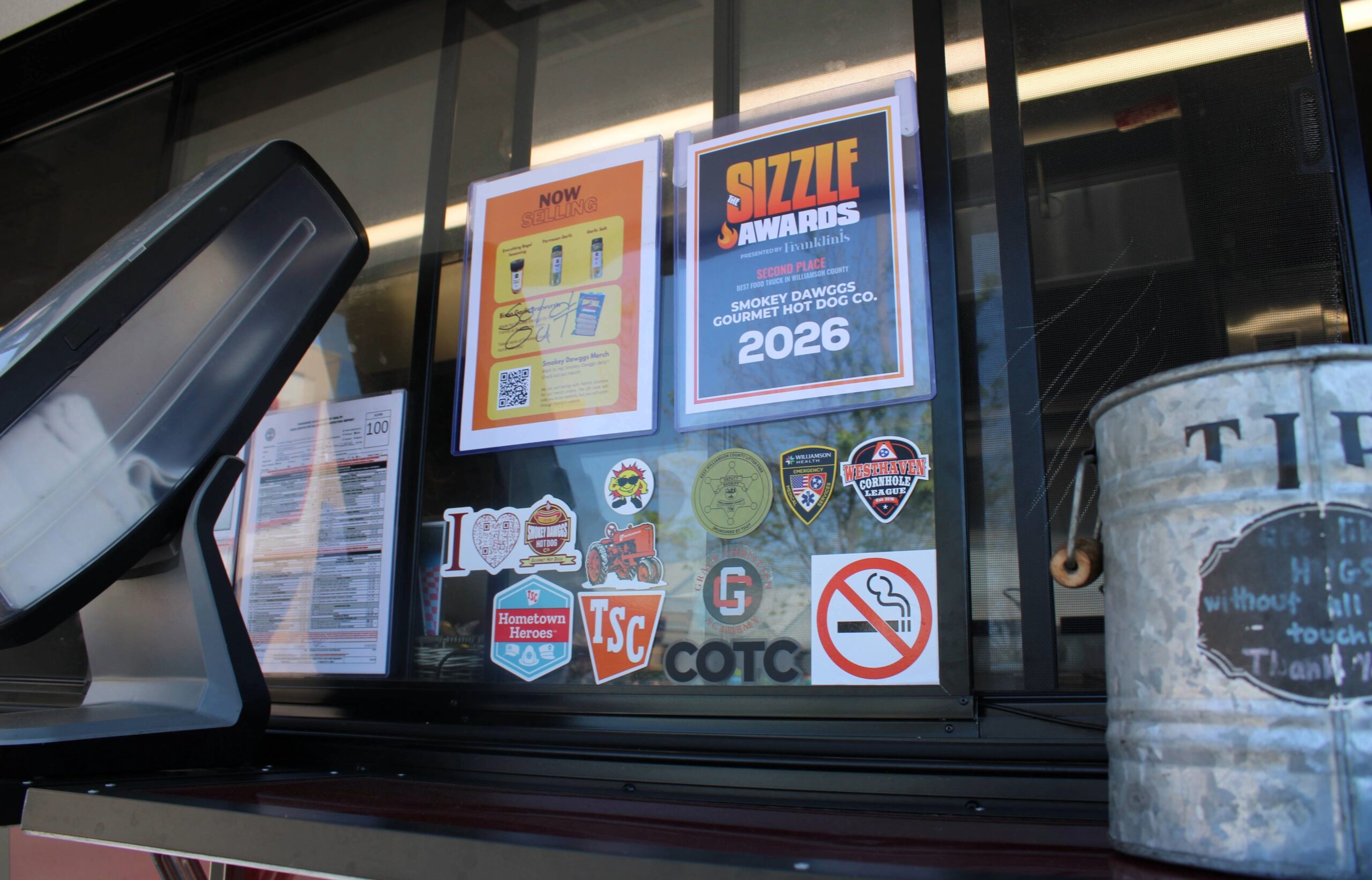 Smokey Dawggs food truck in Franklin TN, 2026 Sizzle Award winner for Best Food Truck, serving gourmet hot dogs to customers.