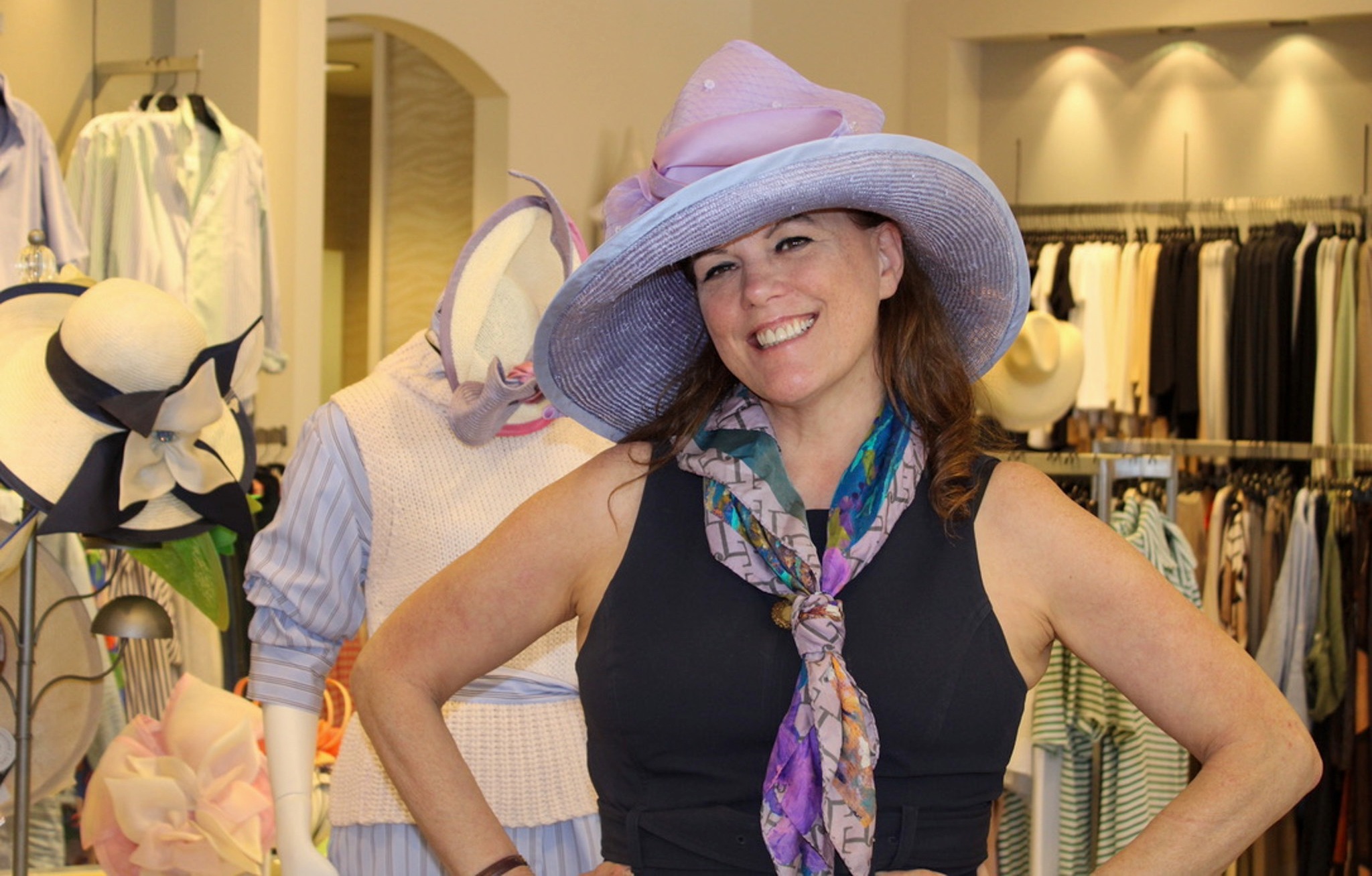 Christine Moore wearing a wide-brim hat at Gus Mayer in Nashville during a trunk show for Iroquois Steeplechase fashion