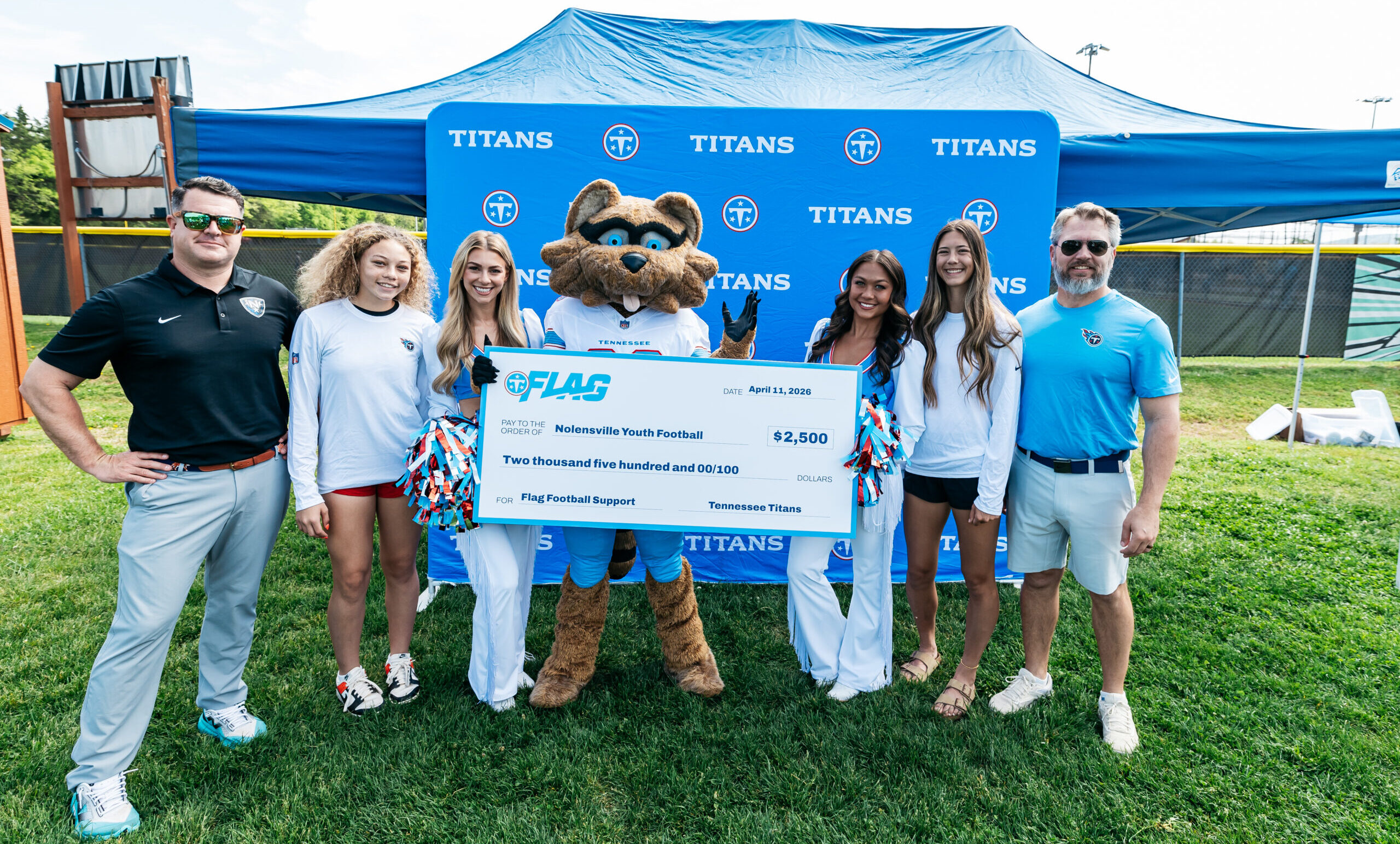 Tennessee Titans and Nolensville Flag Football check presentation event.