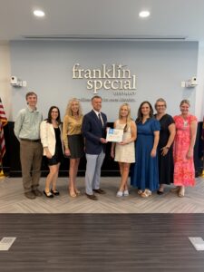 The Franklin Special District's Guiding Coalition Committee received the Model PLC at Work District certificate from Solution Tree's Kathy Natour. Pictured are (left to right) Pax Wiemers, Shelly Robinson, Gina Looney, David Snowden, Mary Decker, Kathy Natour (of Solution Tree), Amber Whitley, and Summer Carlton.