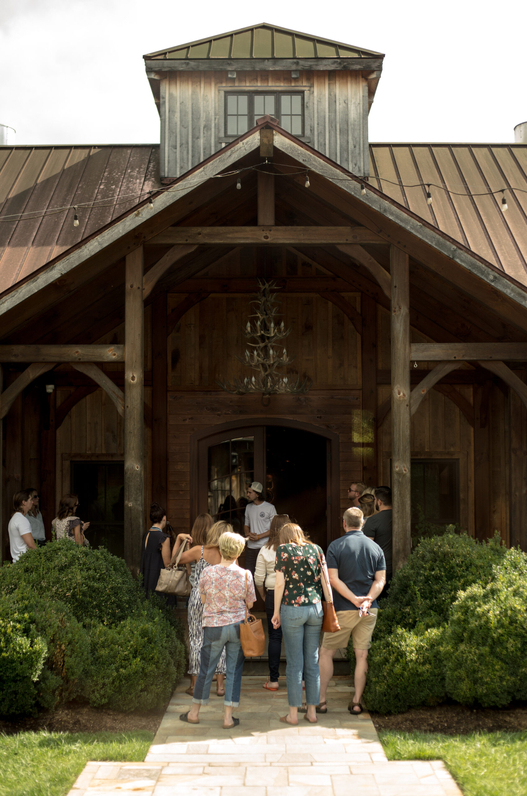 Leiper's Fork Distillery in Leiper's Fork, TN, guided tours, guests walking in the main entrance.