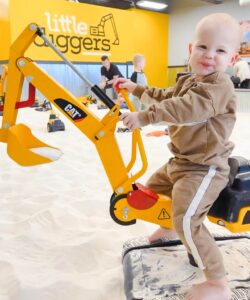 Little Diggers Franklin, TN, child plays in large sandbox with toy trucks