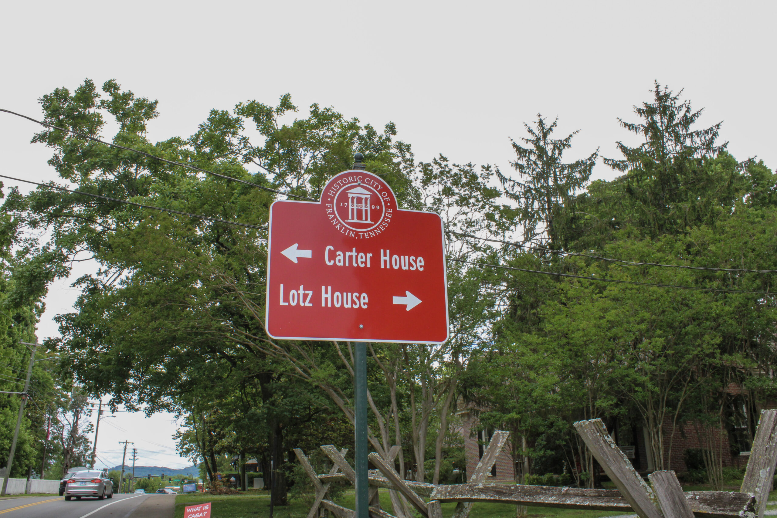 Lotz House Cellar Tour Franklin, TN directional sign for the Carter House and Lotz House in historic Franklin.