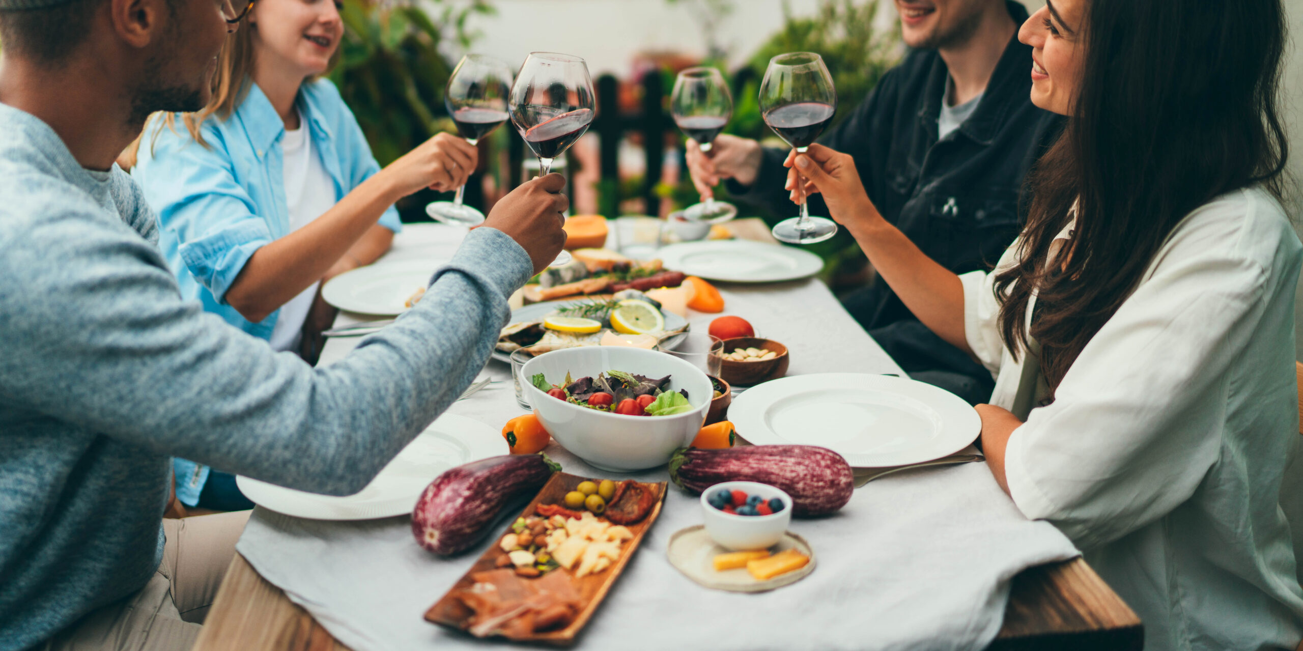 Dining out in Nashville, TN, group of friends sitting at the dinner table enjoying a variety of unique dining experiences featuring immersive meals, chef’s counters, and interactive restaurant concepts