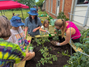 Families gained hands-on gardening experience sowing seeds and arranging plants. 