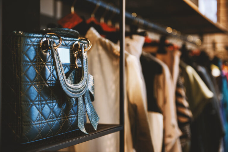 Flip It Franklin Consignment in Franklin, TN, designer handbag and clothing racks at upscale pop-up sale.