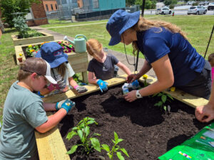 : USA Conservation Coordinator Maggie Sager works with youth participants at Spring Garden Day on May 30 in Nashville. 
